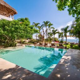 Pool and beachfront loungers — Casa Coco, Isla Mujeres, Mexico