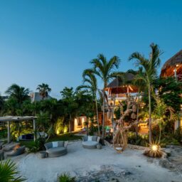 Beachfront lounge area at dusk — Casa Coco, Isla Mujeres, Mexico