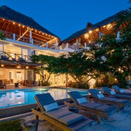 Pool and villa at dusk — Casa Coco, Isla Mujeres, Mexico