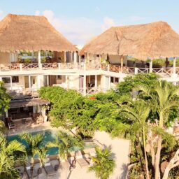 Villa exterior with pool and palm trees — Casa Coco, Isla Mujeres, Mexico