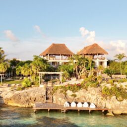 Villa and ocean dock on the rocky shore — Casa Coco, Isla Mujeres, Mexico