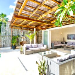 Terrace lounge under a pergola — Casa Coco, Isla Mujeres, Mexico