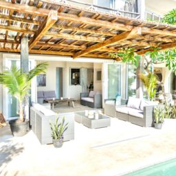 Terrace lounge under a pergola — Casa Coco, Isla Mujeres, Mexico