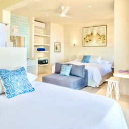 Bedroom with bed and sofa — Casa Coco, Isla Mujeres, Mexico