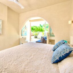 Bedroom with arched doorway — Casa Coco, Isla Mujeres, Mexico