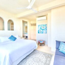 Bedroom with bed and sofa — Casa Coco, Isla Mujeres, Mexico