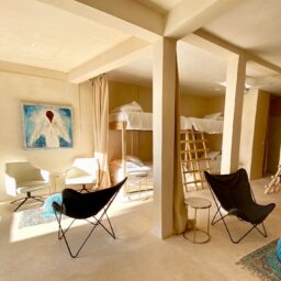 Bedroom with bunk beds and sitting area — Casa Coco, Isla Mujeres, Mexico