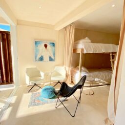 Bedroom with bunk beds and sitting area — Casa Coco, Isla Mujeres, Mexico