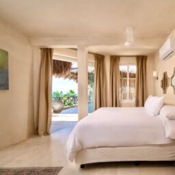 Bedroom with bed and terrace access — Casa Coco, Isla Mujeres, Mexico