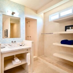 Bathroom with vanity and shelves — Casa Coco, Isla Mujeres, Mexico