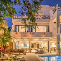 Villa exterior and pool at dusk — Casa Lola, Isla Mujeres, Mexico