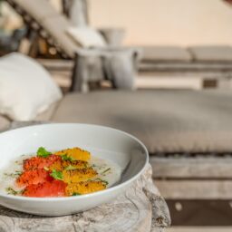 Chef-prepared dish on a lounge terrace — Casa Lola, Isla Mujeres, Mexico