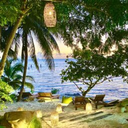 Beachfront lounge at sunset — Casa Lola, Isla Mujeres, Mexico