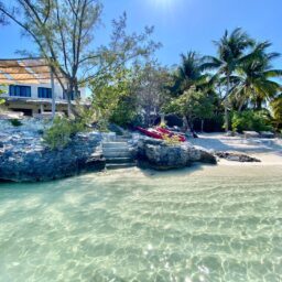 Beach with stone steps and kayaks — Casa Lola, Isla Mujeres, Mexico