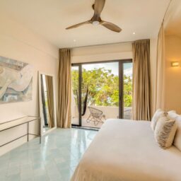 Bedroom with ceiling fan and balcony — Casa Lola, Isla Mujeres, Mexico