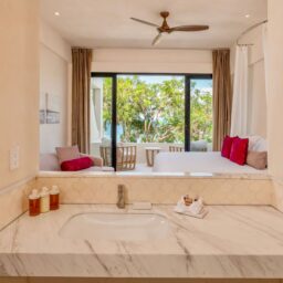 Bathroom vanity and bedroom balcony — Casa Lola, Isla Mujeres, Mexico