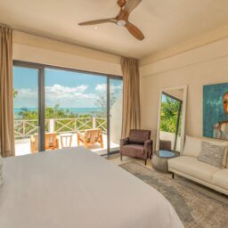 Bedroom with balcony and sitting area — Casa Lola, Isla Mujeres, Mexico