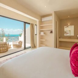 Bedroom with ocean-view balcony — Casa Lola, Isla Mujeres, Mexico
