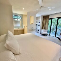 Bedroom with bed and balcony — Villa Encantada, Isla Mujeres, Mexico