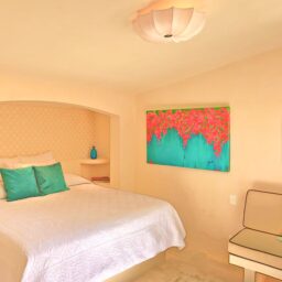Bedroom with bed and artwork — Villa Encantada, Isla Mujeres, Mexico