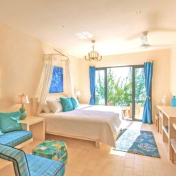 Bedroom with canopy bed and balcony — Villa Encantada, Isla Mujeres, Mexico