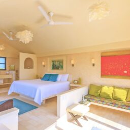 Bedroom with bed and sofa — Villa Encantada, Isla Mujeres, Mexico